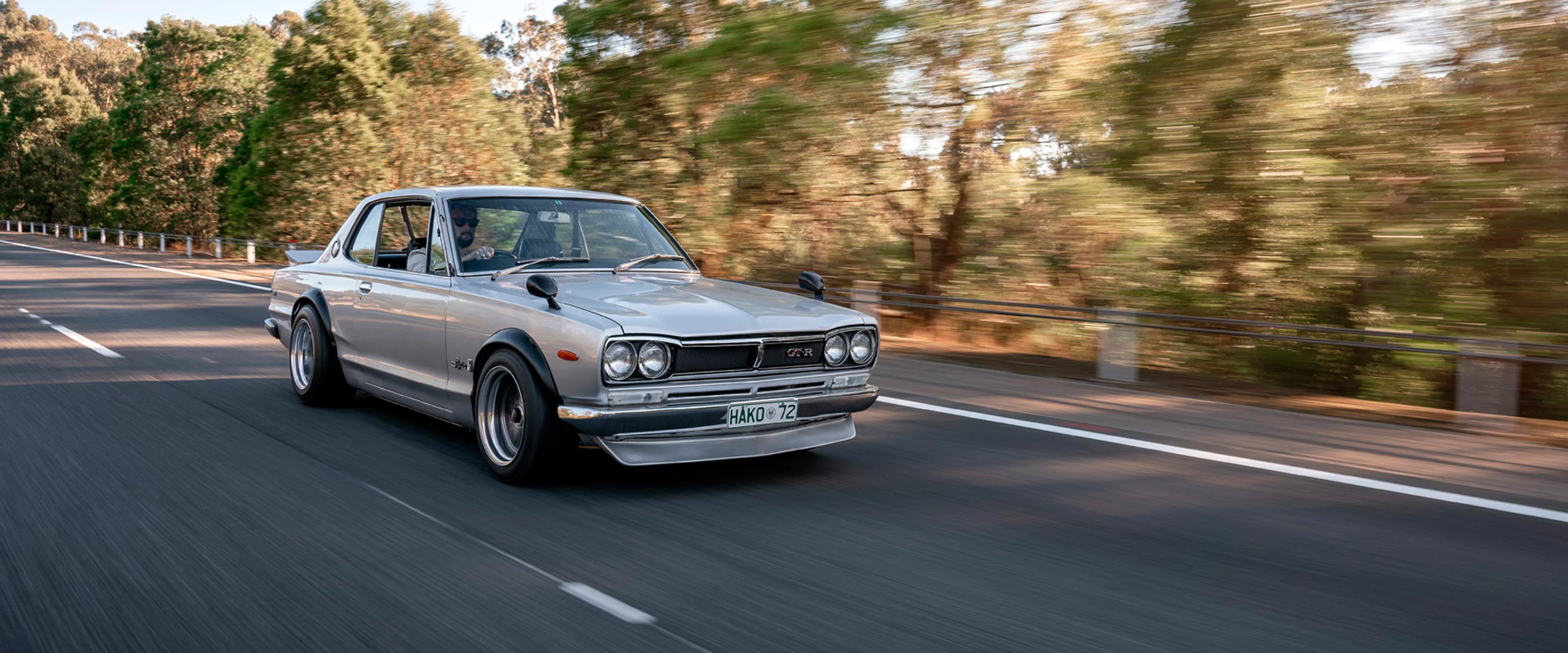 Classic Nissan Skyline GTR on a scenic road